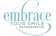 Dental clinic logo with the phrase "embrace your smile" and a graphic of braces.